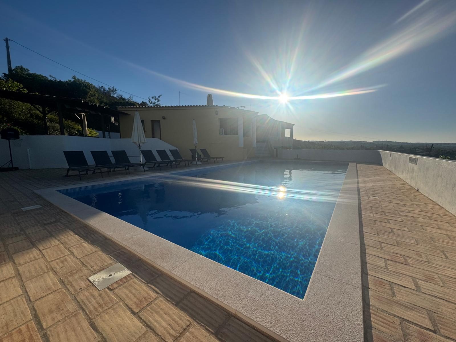 Casa das Rochas pool at sunset